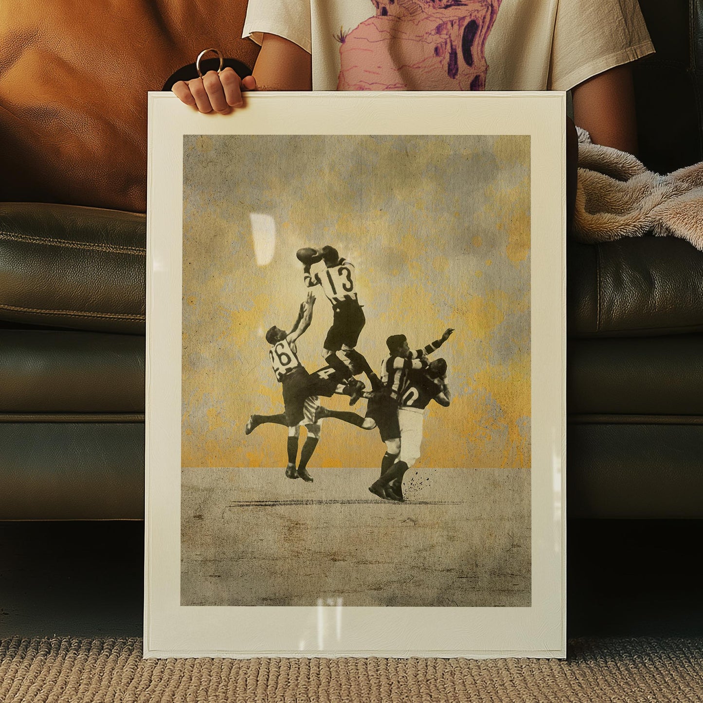 Framed Dick Lee artwork shown in studio — archival-style football print for collectors and contemporary man cave design
