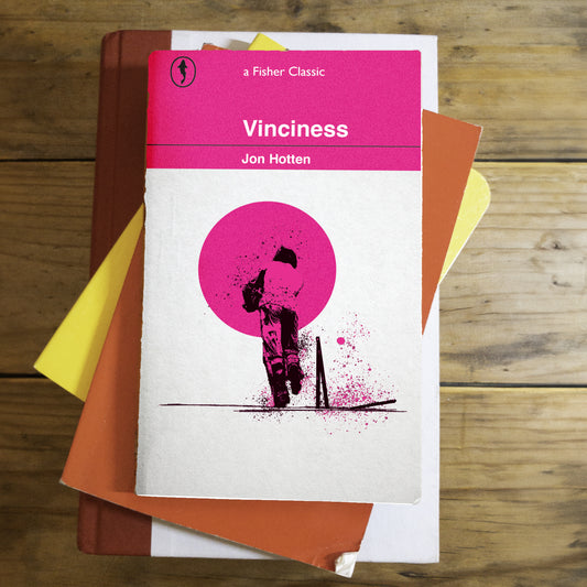 Vinciness paperback cover mockup arranged with stacked books and paper textures
